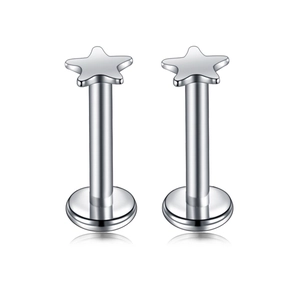 Detailed view of stainless steel labret studs with polished star-shaped tops and flat base