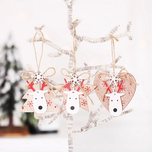 Three-piece wooden Christmas pendants with reindeer and snowflake details on white branches