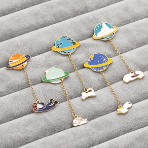 Set of five space-themed enamel pins featuring planets and cute astronaut animals on gold chains
