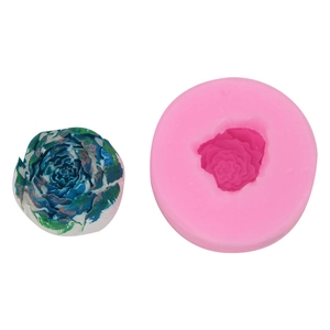 Detail of pink silicone 3D rose mold and a multi-colored floral cake topper decoration