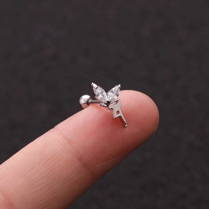 Silver bee wing screw-back stud earring with sparkling cubic zirconia on a fingertip