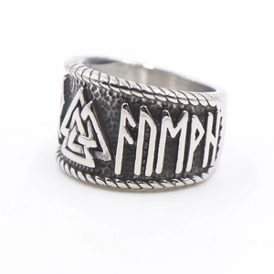 Close-up of Viking Valknut symbol and Runic alphabet engraved on a vintage steel ring