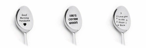 Detailed view of three stainless steel coffee spoons with custom engraved gift messages
