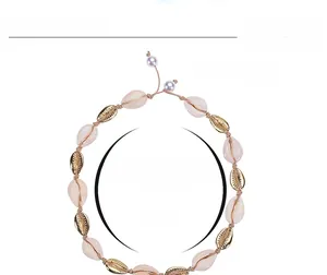 Detail of adjustable bohemian shell choker with braided cord and 35.8g weight specification