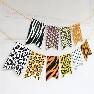 Detail of tropical safari party banners featuring leopard and zebra animal prints