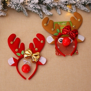 Christmas reindeer antler headbands with bells and bows on festive background