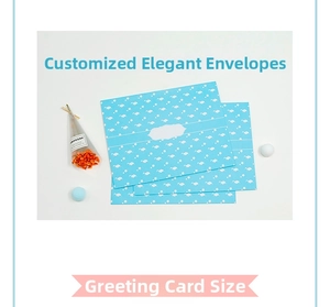 Light blue DIY Christmas card kit with envelope featuring white stars and cloud patterns
