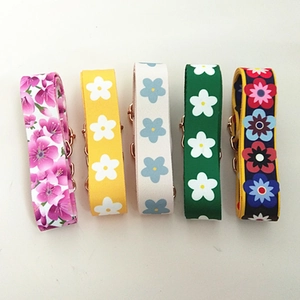 Detailed view of adjustable floral fabric straps with premium rose gold metal hardware