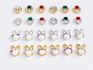 Detail view of pearl rabbit charms and square gemstones for nail art accessories