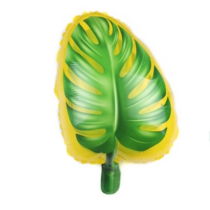 Close-up of tropical monstera leaf shaped foil balloon with metallic gradient finish