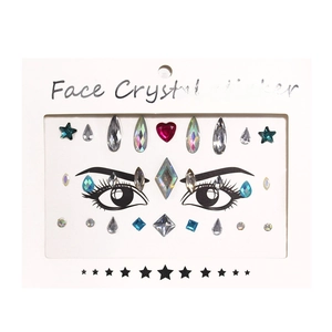 Detailed view of colorful face crystal stickers with star and eye patterns on white backing