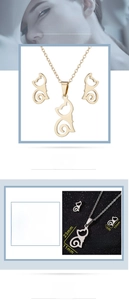 Detailed view of cat-shaped stainless steel necklace and earrings set with measurements