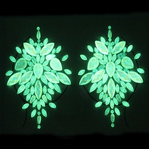 Luminous green resin face and body crystals set with glowing symmetrical gem pattern