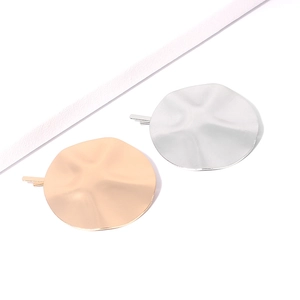 Minimalist gold and silver round geometric hair clips with irregular wavy metal texture