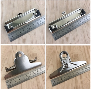 Detail showing four styles of silver stainless steel metal board clips with hanging holes