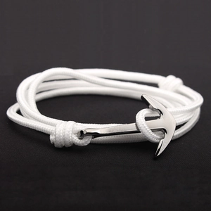 Detail of multi-layered white nylon rope bracelet with silver anchor metal buckle clasp