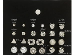 Detail view of 12 pairs of silver-tone stud earrings with pearls and rhinestones on card