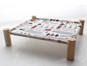 Detail of wooden pet hammock with Paris theme printed canvas for small cats and dogs