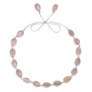 Detail view of handmade bohemian shell necklace with adjustable white woven cord