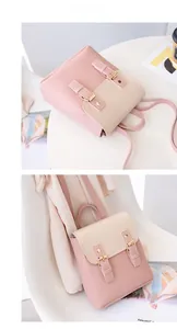 Mini sac à dos bicolore en similicuir rose et beige avec boucle dorée et poignée chic