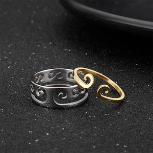 Journey to the West themed gold and silver ring set featuring cloud and staff patterns