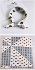 Detailed pattern of small square silk scarf with brown hearts and plaid patchwork design