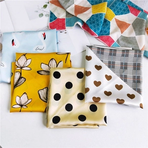 Silk-feel square scarves featuring swan, lotus, and geometric patterns on white background