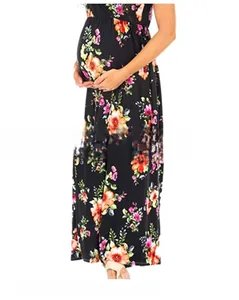 Detail of floral printed maternity maxi dress showing 3D tailoring and flowing hemline