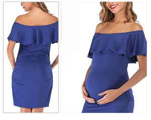 Detail of royal blue maternity dress with off-shoulder ruffles and side ruching