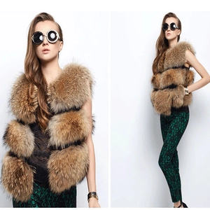Women's multi-layered dark brown raccoon fur vest in a stylish and fluffy texture
