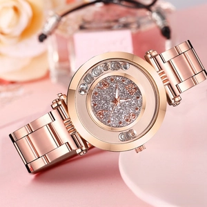 Detail of rose gold watch with sparkling diamond dial and moving zircon stones
