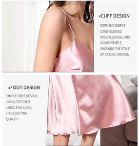 Detail view of pink satin slip nightgown showing thin straps and silky draped fabric hem