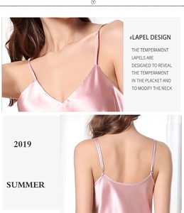 Detailed view of pink satin camisole featuring a V-neck design and delicate silk texture