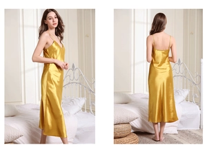 Detailed view of glossy golden satin sleepwear with thin straps and elegant V-neck design