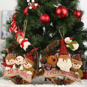Detail of Christmas rattan wreaths with Let It Snow and Merry Christmas embroidery banners