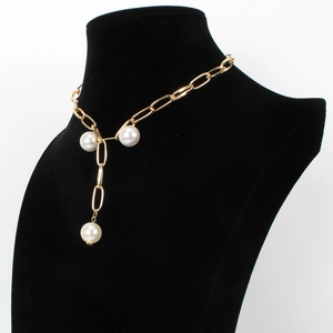 Detailed view of gold link chain Y-necklace with elegant faux pearl accents