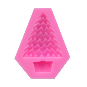 Detail of a pink Christmas tree silicone mold with textured interior for DIY candle making