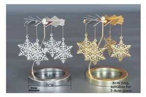 Details von goldenen und silbernen drehbaren Windrad-Kerzenhaltern mit Schneeflocken