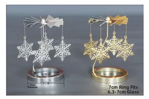 Detailansicht der goldenen und silbernen rotierenden Schneeflocken-Kerzenhalter-Aufsätze
