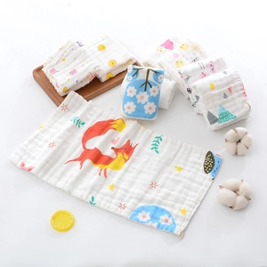 Detail of soft 6-layer muslin cotton baby towels with cute fox and sun patterns