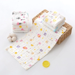 Detail showing soft six-layer cotton gauze baby towels with colorful cartoon prints