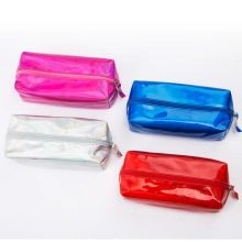 Close-up of four laser PU leather pouches in pink, blue, silver, and red colors