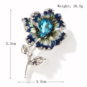 Elegant crystal flower brooch in blue and white enamel with sparkling rhinestones