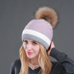 Women's tricolor knit beanie in pink, white and gray with large brown faux fur pom pom