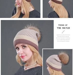 Detailed views of tricolor knit beanie with fluffy faux fur pompom and soft texture