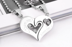 Detailed view of silver heart pendant with I Love You engraving and sparkling crystal inlay