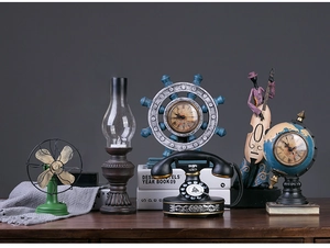 Vintage industrial resin ornaments set featuring retro telephone and globe clock on dark wood