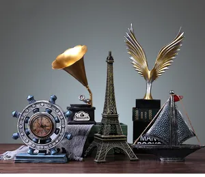 Set of five vintage bronze decorative sculptures including a ship wheel clock and gramophone