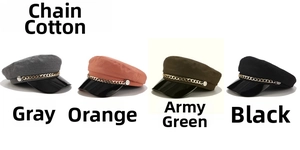 Flat lay of newsboy caps in gray orange army green and black with gold chain detail
