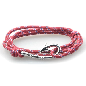 Detailed view of red nautical braided rope bracelet with blue accents and metal anchor hook